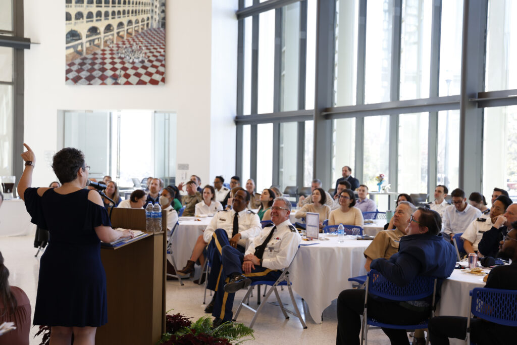 Speaker in front of audience at Advising Summit