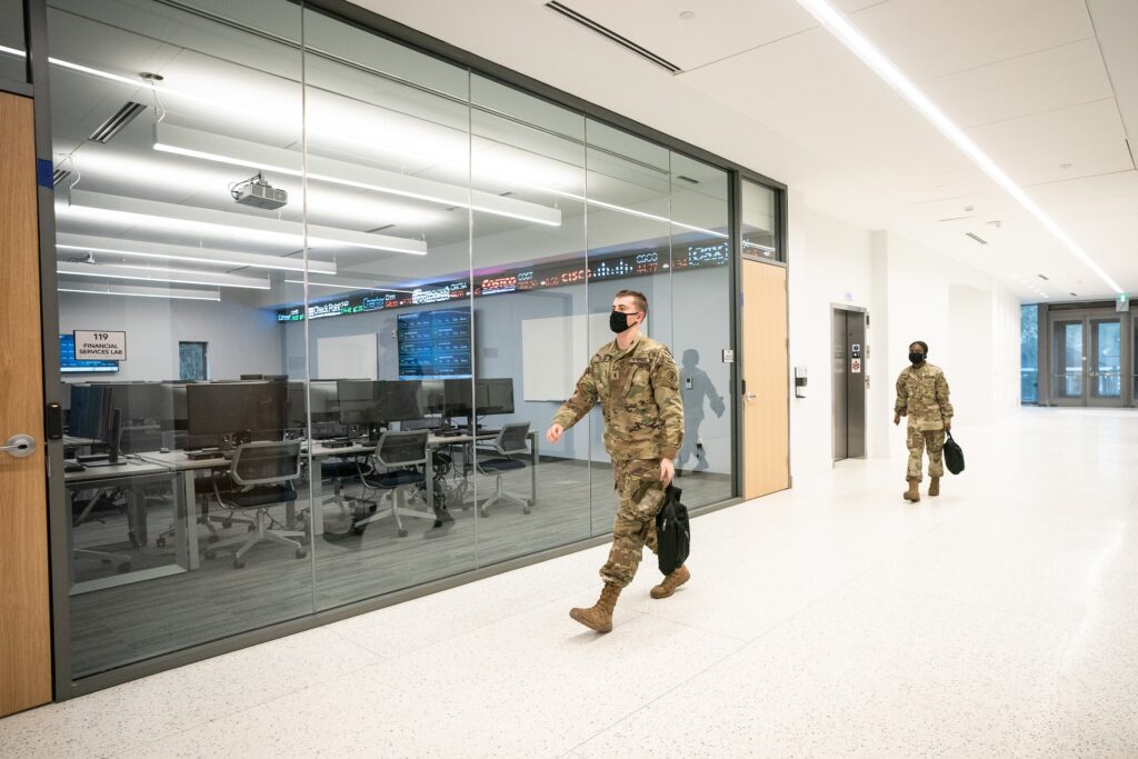 Cadet walking in front of Financial Lab