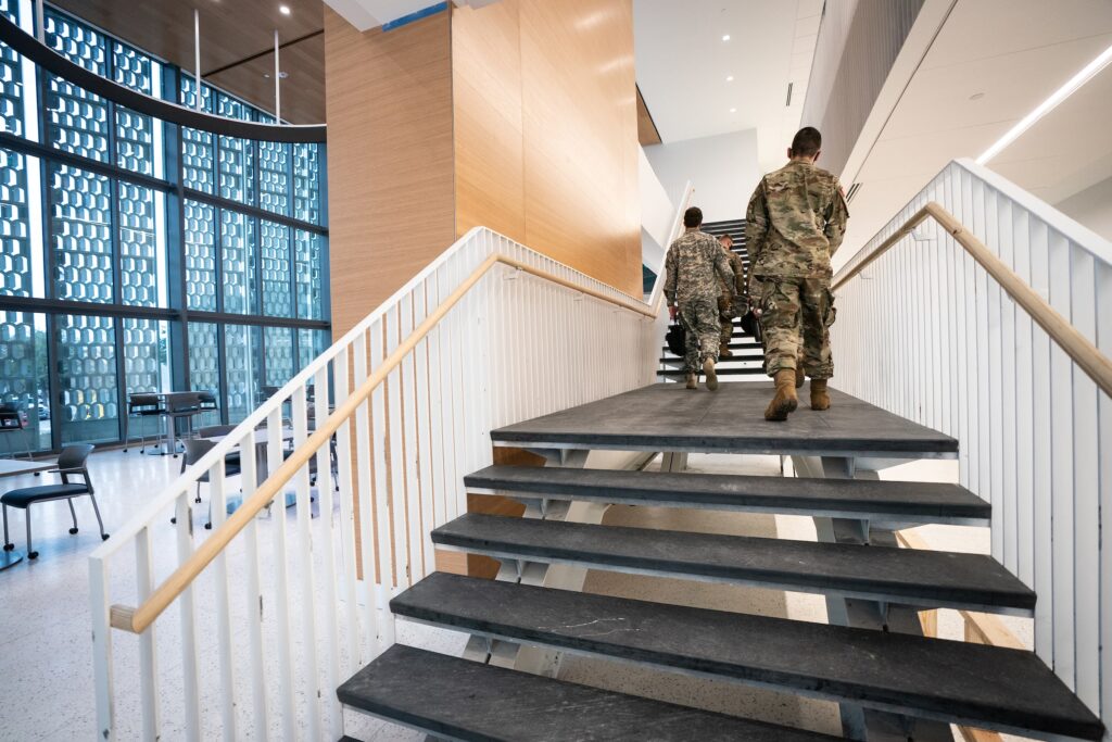 Cadets walking up stairs in Bastin Hall