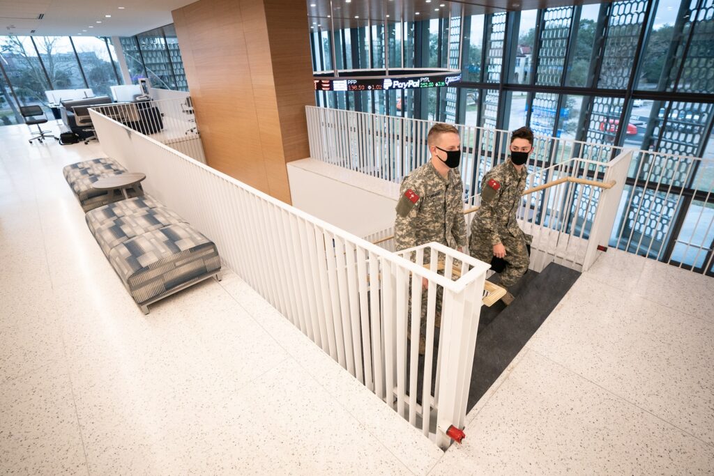 Cadets walking up stairs in Bastin Hall