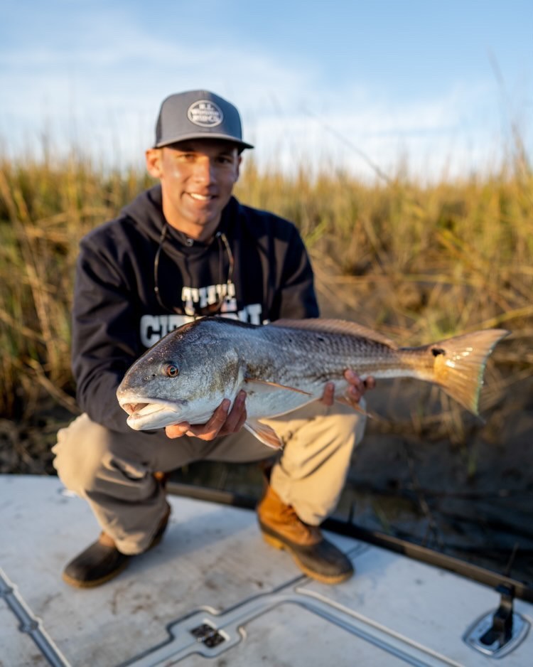 Fishing club member with fish 