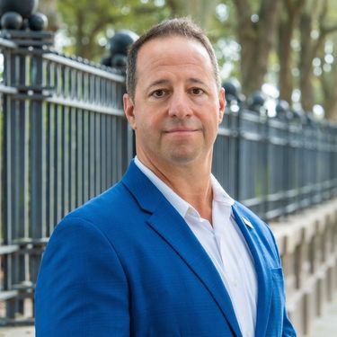 Professional headshot of AJ Leone