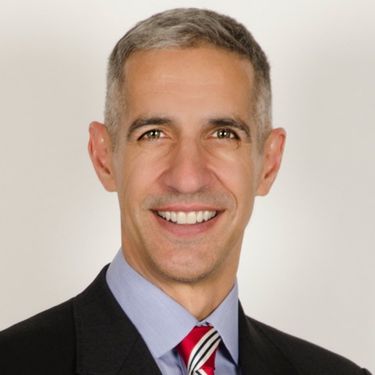 Professional headshot of DJ Peterson