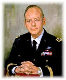 Portrait of a U.S. Army officer in dress uniform seated with his hands clasped.