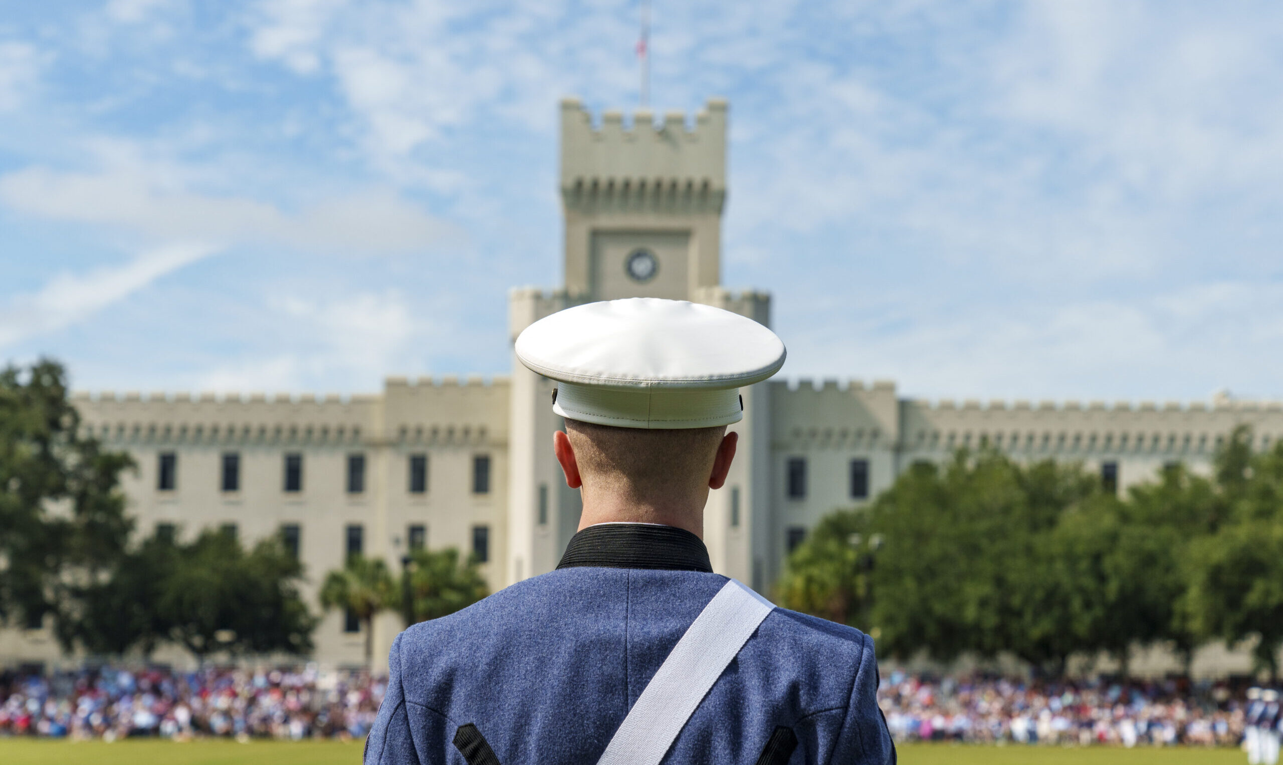 Cadet standing in front of barracks 