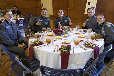 Photo of happy attendees at table.