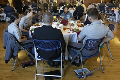 Photo of attendees enjoying conference.