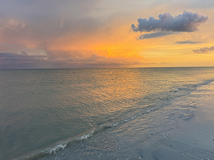 A photograph of a sunset over the ocean