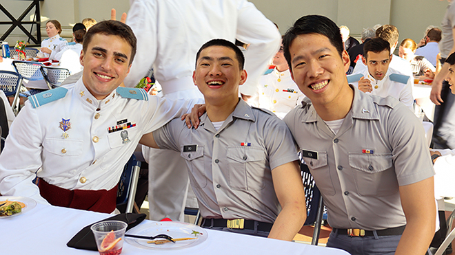 Three men sitting together at a table