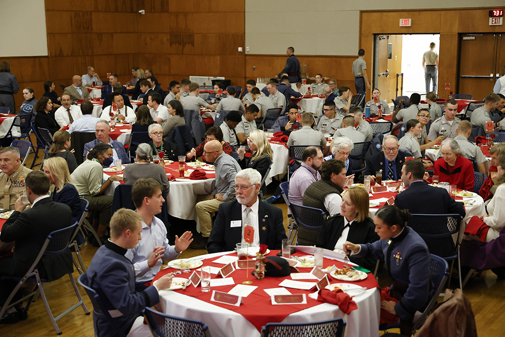 People at their tables enjoying the event.