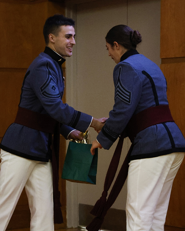 Luke Frazier gives raffle prize to Michaela Martin.