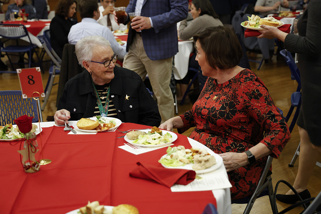 Guests smiling at their table