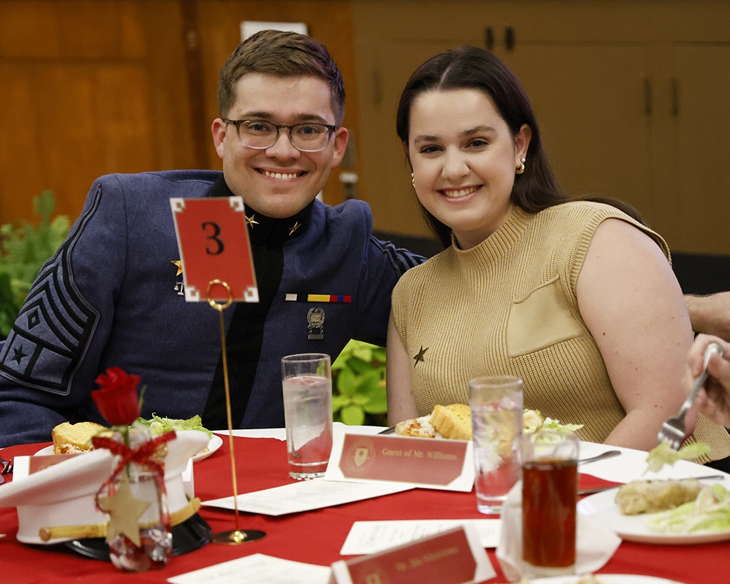 Speaker Robert Isaac Williams with his girlfriend at their table.