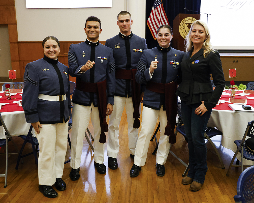 Editors Kaitlin Hatchew and Quentin Walsh posing with Editor-In-Chief Noah Miller, speaker Olivia Liquori, and a guest.