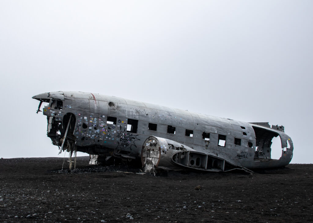 Jess Pierce, Graduate Student, MBA Program - Plane on Black Sand