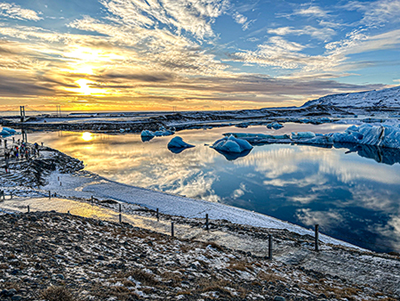 Photograph of icy water during sunrise