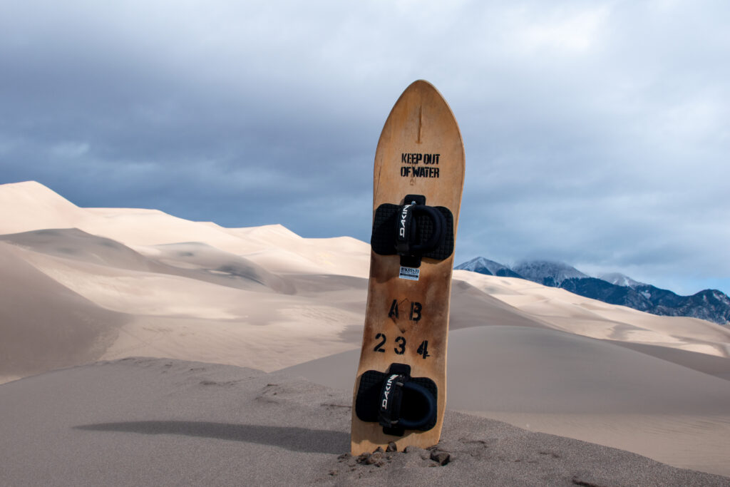 Jess Pierce, Graduate Student, MBA Program - Sandboard in Dunes