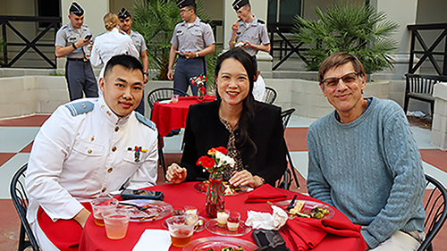 Wei Shan Lu and two guests sitting at a table