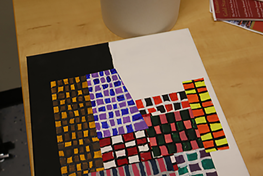 An unacceptable submission. The artwork is not fully in the photo, not centered, and there are things in the background