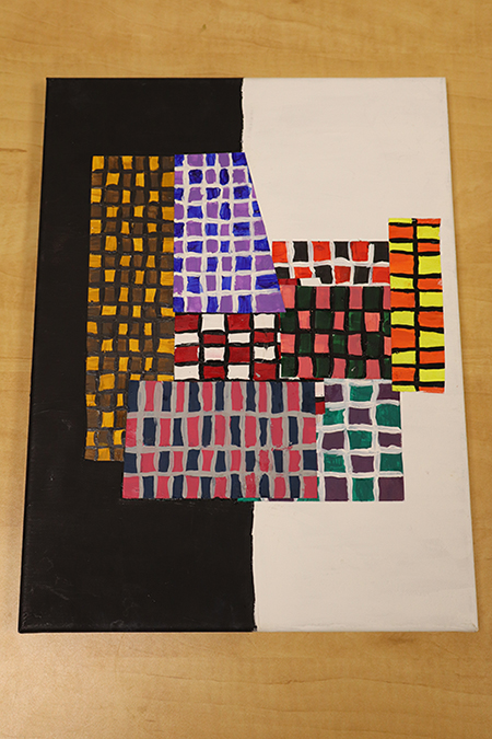 An unacceptable submission. the artwork is centered, but the photo is not cropped and it is taken at an angle
