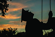 Inside Cover Photograph of a cadet raising the flag.