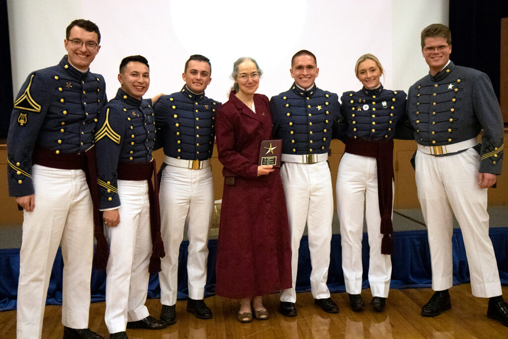 Photograph of the Editors presenting Dr. Mabrouk a plaque of appreciation.