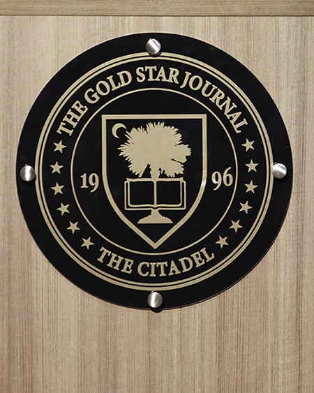 The Gold Star Journal logo on a lectern