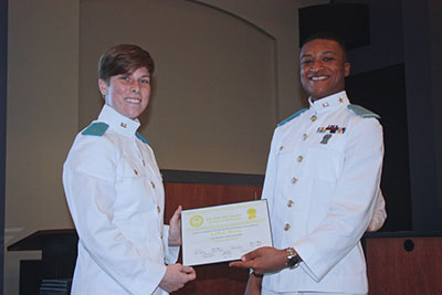 Carleton Bailiff III presenting Kaytlynne McCord with her Certificate of Publication.