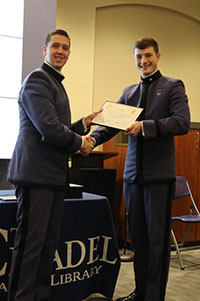 James Quimby presenting William Rasberry with his Certificate of Publication.