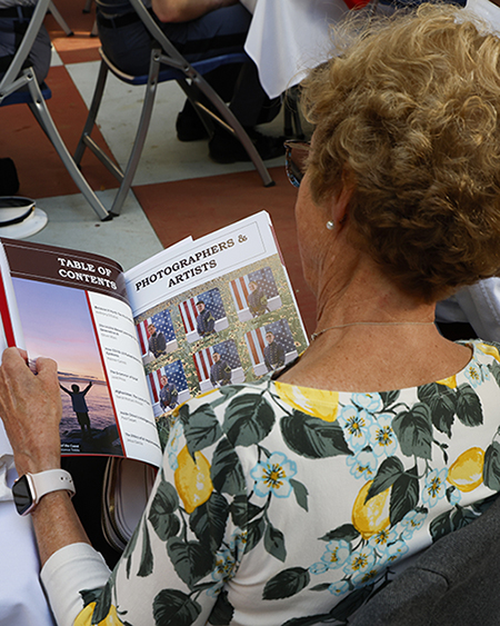 Woman reading the Gold Star Journal