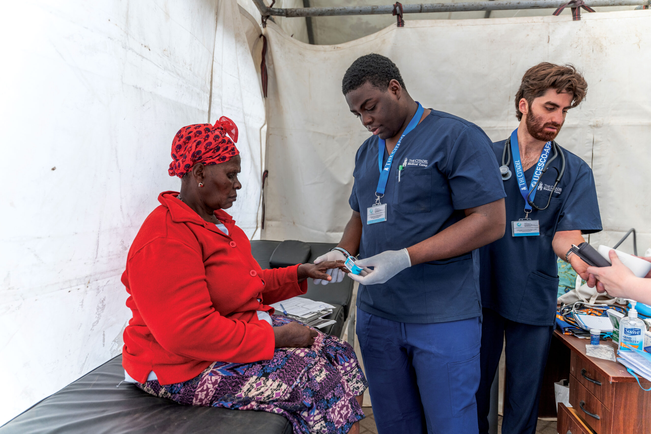 Citadel medical students provide care to a patient during a medical mission clinic.