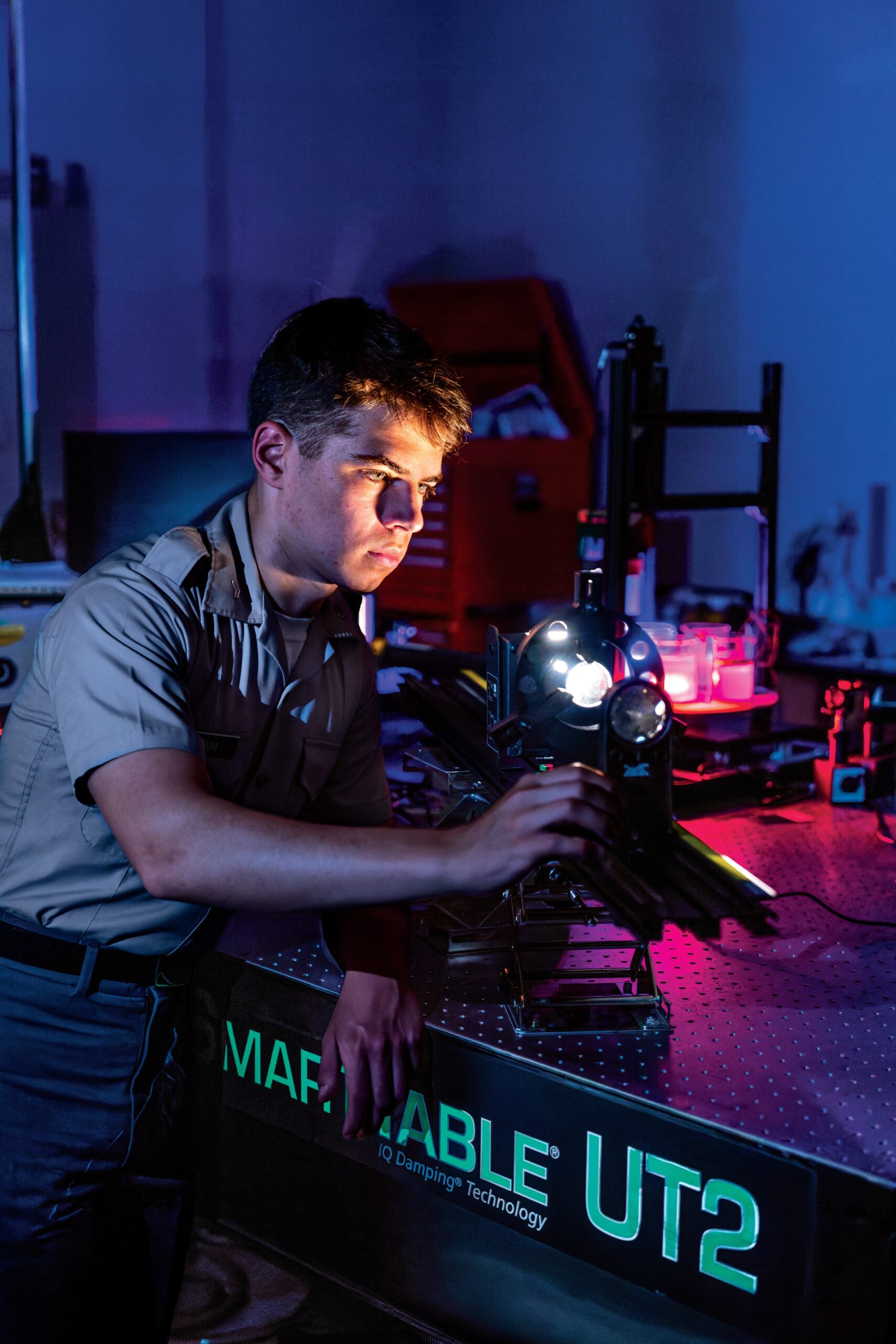 Cadet adjusts an optical instrument while conducting photonics research in an engineering laboratory at The Citadel.