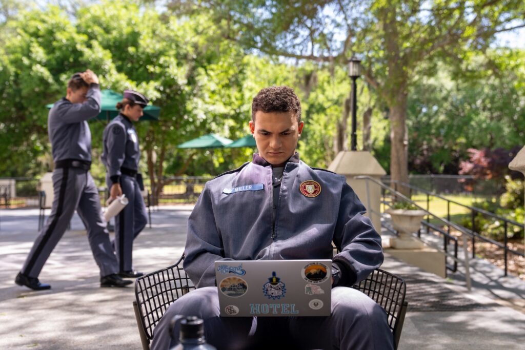 Cadet on his laptop on Citadel campus