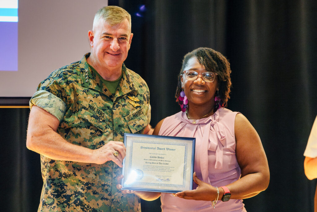 Gen. Glenn Walters presents a PAWS award to Coletta Bethea during the town hall meeting Sept. 14, 2023 in Charleston, South Carolina.