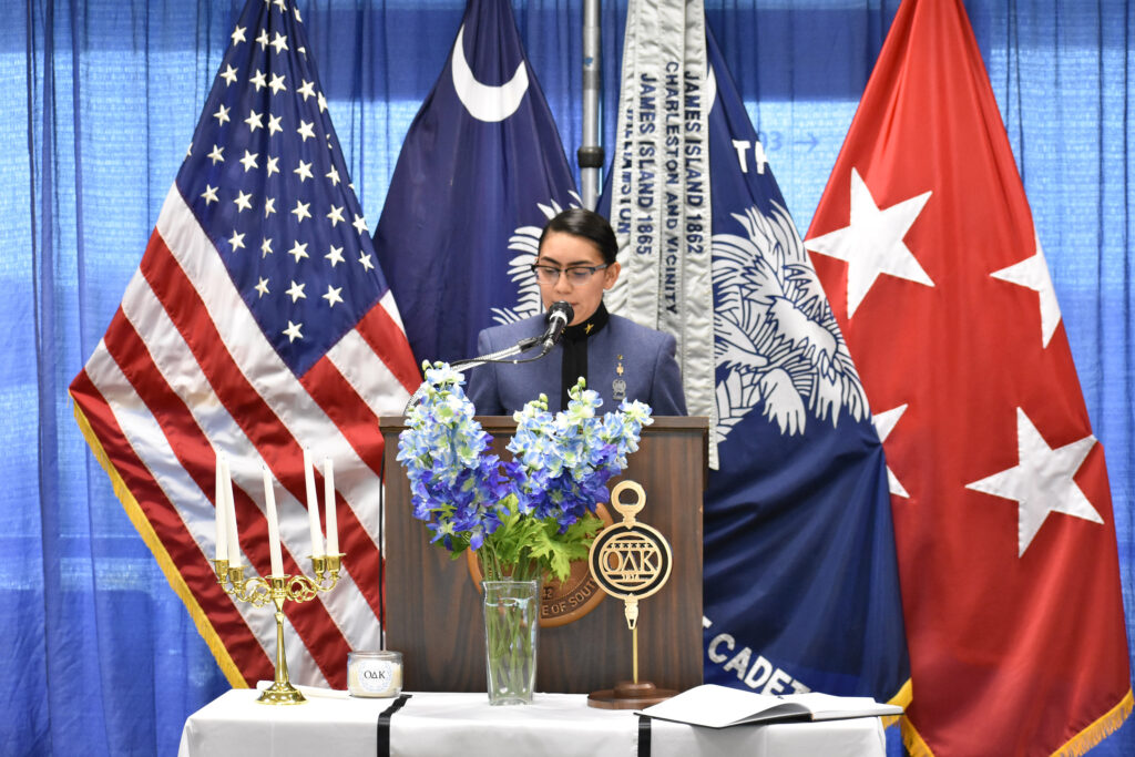 Citadel cadet speaks at a podium during an Omicron Delta Kappa ceremony.