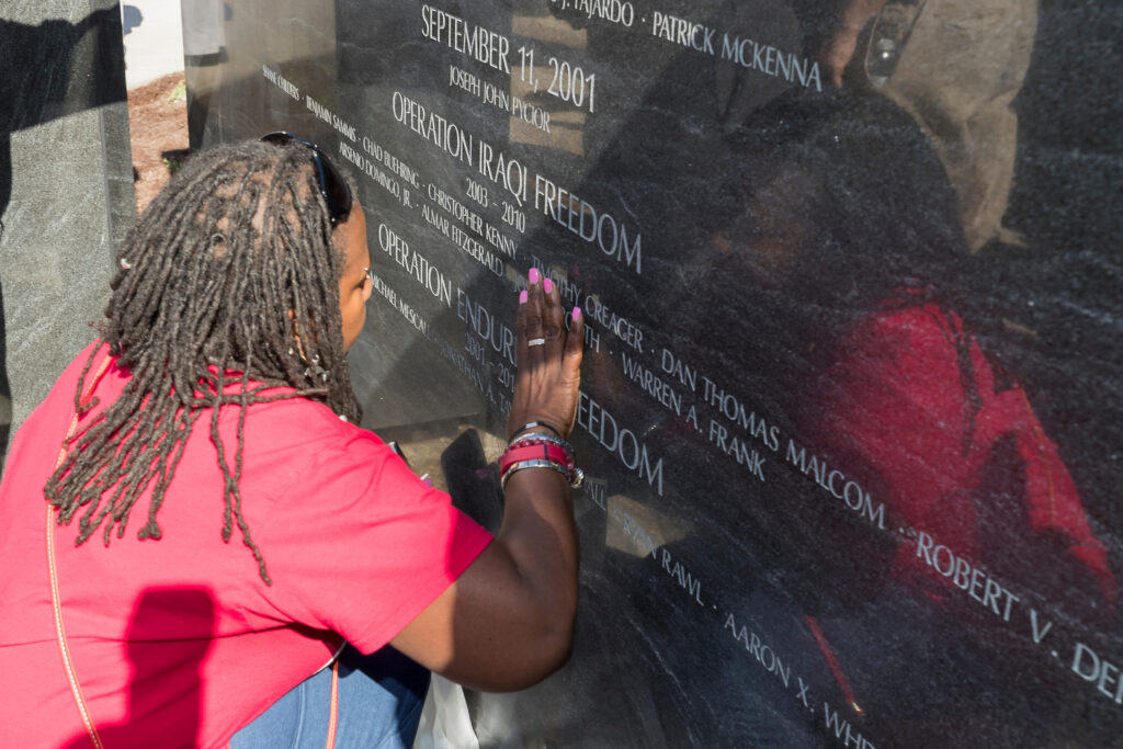 touching the war memorial