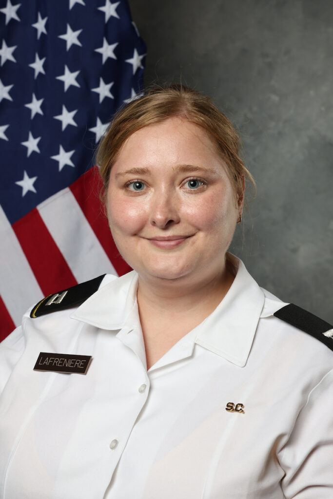 Hope LaFreniere, Ph.D., photographed in The Citadel photography studio with a United States flag backdrop.