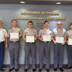 The Citadel cadets stand with professor at the University Physics Competition