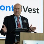 Standing at a podium, Tom Barkin, president and CEO, Federal Reserve Bank of Richmond, speaks to participants of the The Citadel Directors' Institute.