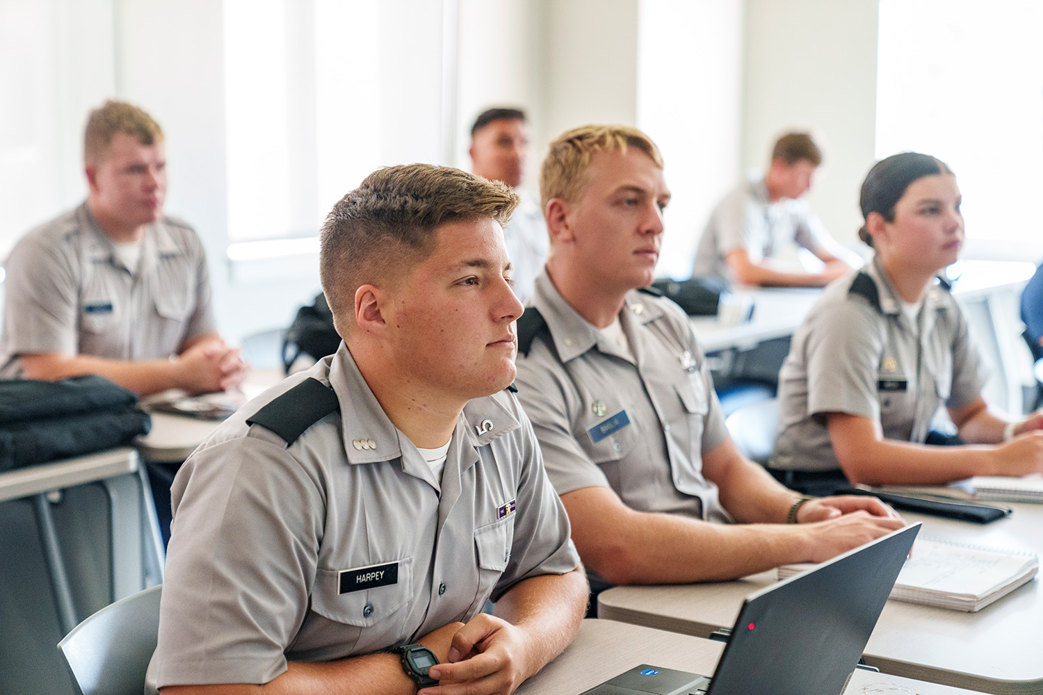 Citadel cadets sit at desks and listen during a class in Capers Hall.
