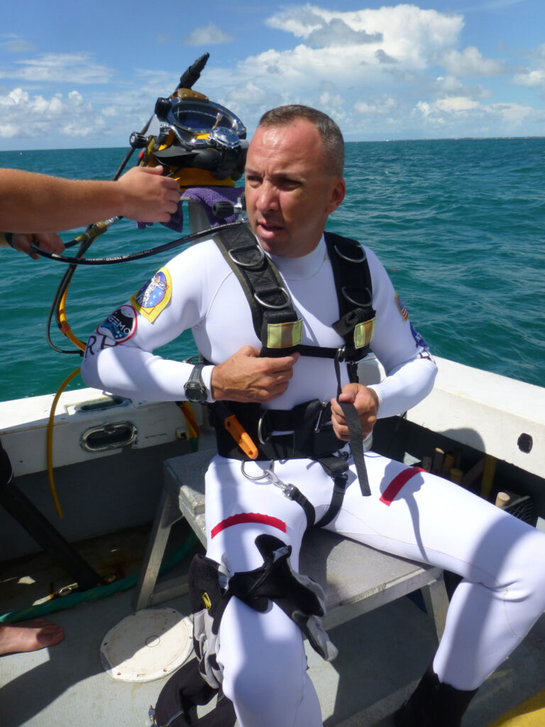 Randy Bresnik prepares for a dive aboard a boat during a mission.