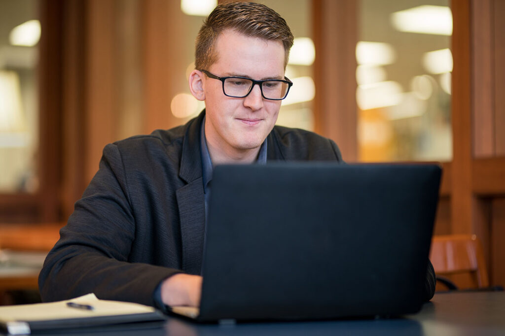 Male student on laptop