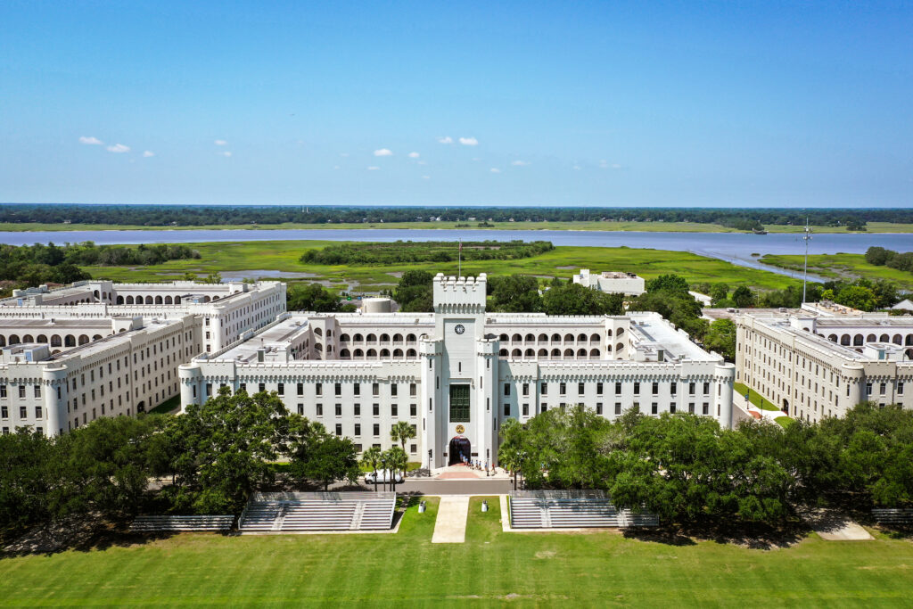 Landscape image of The Citadel barracks with the Ashley River in the background.